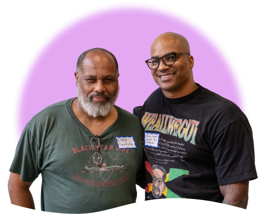 A photograph of two worker owners at Sankofa Bookstore and Cafe. A photograph of two worker owners at Sankofa Bookstore and Cafe.